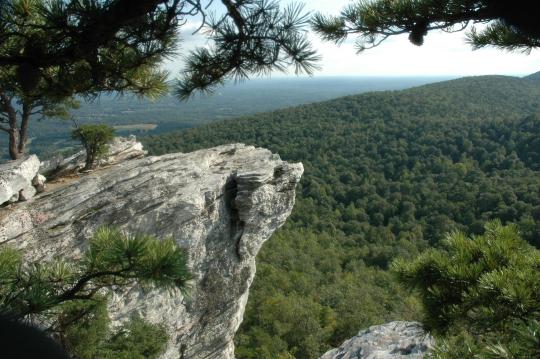 Rock cliff overlooking wooded valley at Hanging Rock State Park